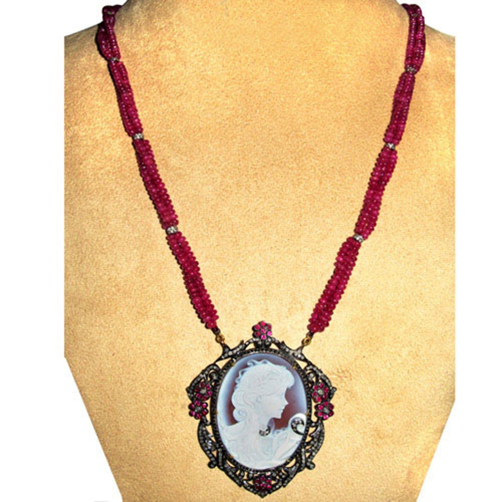 Cameo carved diamond pendant with ruby beads necklace